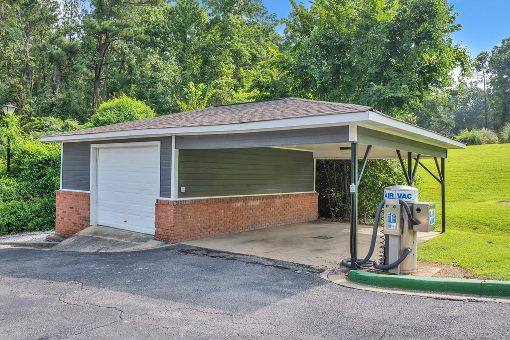a gas station with a pump in front of it